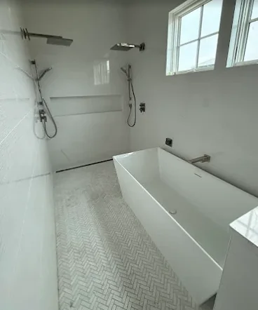 Luxury walk-in shower with dual wall-mounted rainfall fixtures in Santa Rosa Beach